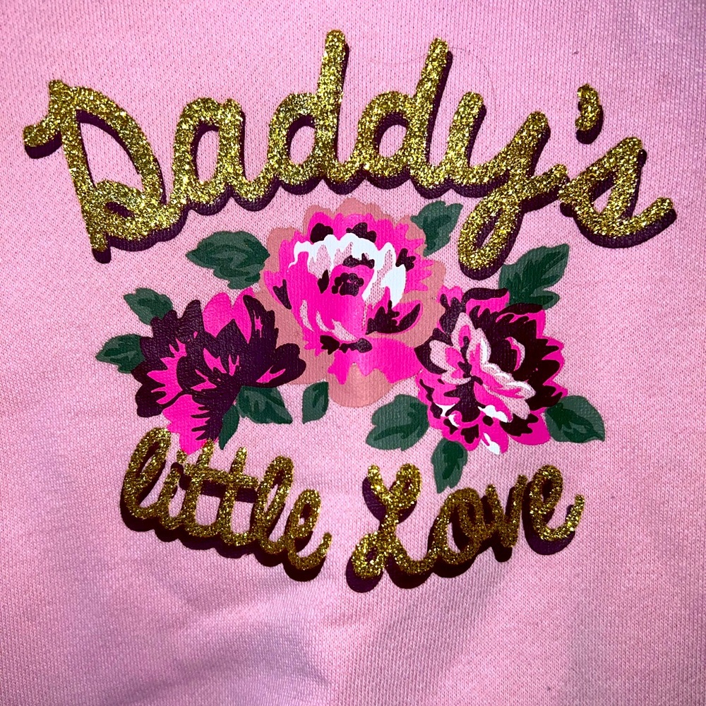 Pink “daddy’s little love” sweater.